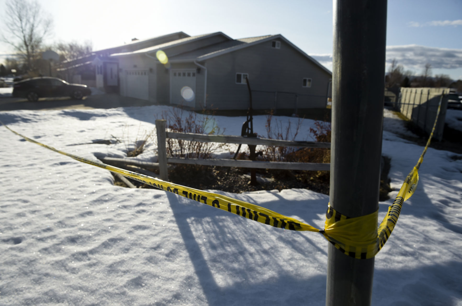 Crime scene tape surrounds a home where authorities are investigating the deaths of two people in the Treasure State Acres neighborhood.